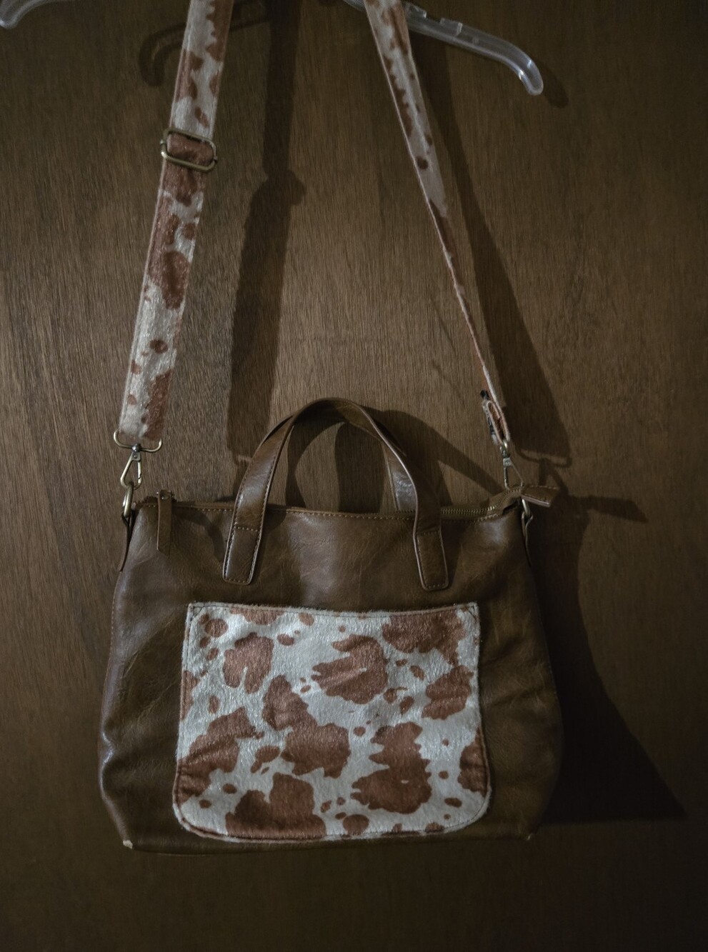 Brown Leather Pursewith Cowhide Accent Front Pocket And AdjustableShoulder Strap